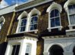 Timber double glazed windows with dummy arches
