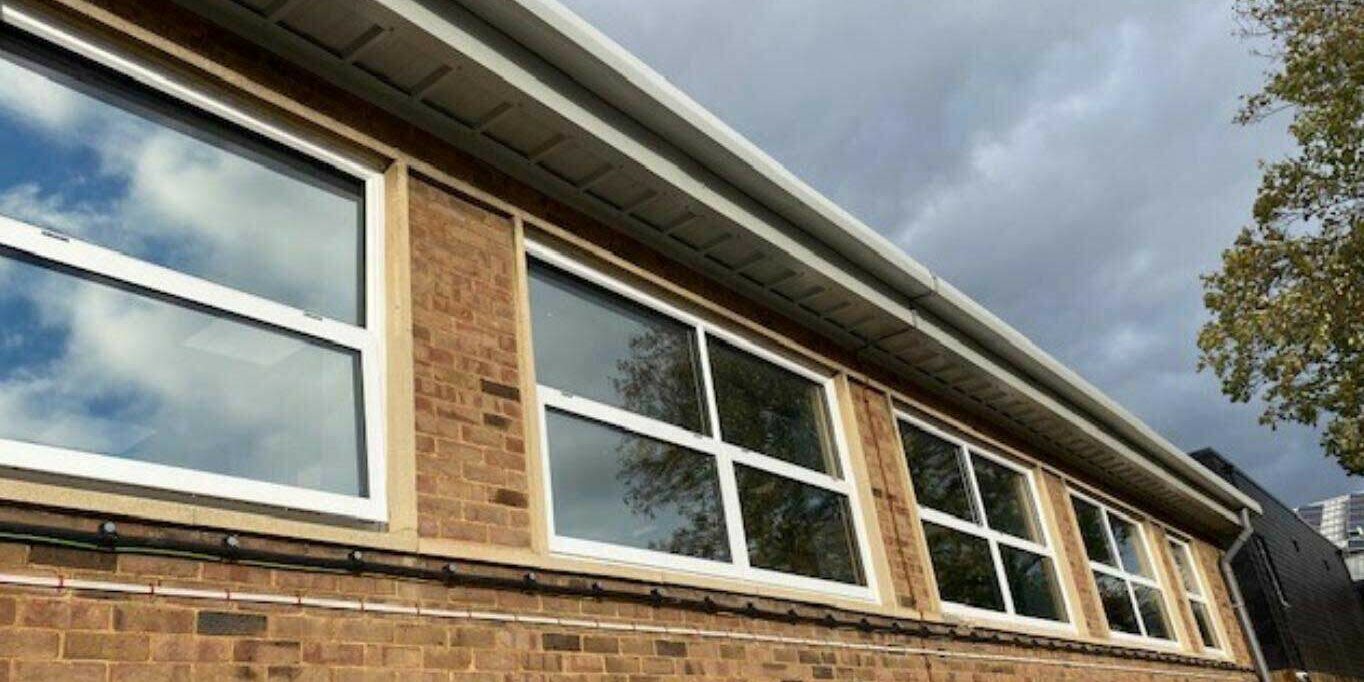 White aluminium windows with teleflex gearing